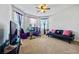 Home office with a desk, chair, and a comfortable sofa at 909 Teabiscuit Way, Mcdonough, GA 30253