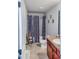 Bathroom with double vanity, tub shower, and dark-colored curtains at 231 Magnaview Dr, Mcdonough, GA 30253