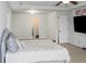 Spacious primary bedroom with large bed, TV mount, and ample room at 231 Magnaview Dr, Mcdonough, GA 30253