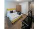 Cozy bedroom with a yellow bed frame and plenty of floor space at 231 Magnaview Dr, Mcdonough, GA 30253