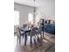 Spacious dining area with dark wood table and gray chairs, hardwood floors at 231 Magnaview Dr, Mcdonough, GA 30253