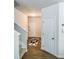 Bright entryway with hardwood flooring, neutral walls, and coat closet at 231 Magnaview Dr, Mcdonough, GA 30253