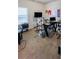 Bright home office with neutral carpeting, featuring a large desk and window at 231 Magnaview Dr, Mcdonough, GA 30253