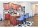 Modern kitchen with stainless steel appliances, granite countertops, and hardwood floors at 231 Magnaview Dr, Mcdonough, GA 30253