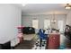 Open concept kitchen and living room with dark hardwood floors and neutral walls at 231 Magnaview Dr, Mcdonough, GA 30253