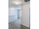 Upstairs hallway with neutral carpeting and a small window, leading to bedrooms at 231 Magnaview Dr, Mcdonough, GA 30253