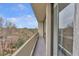 Bright sliding glass doors open to a balcony with relaxing city views at 2575 Peachtree Ne Rd # 11D, Atlanta, GA 30305