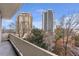 This spacious balcony offers beautiful city views and cozy outdoor seating at 2575 Peachtree Ne Rd # 11D, Atlanta, GA 30305