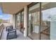 Large sliding glass doors open to a relaxing balcony with outdoor seating at 2575 Peachtree Ne Rd # 11D, Atlanta, GA 30305