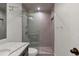 Modern bathroom featuring a glass enclosed shower, stylish vanity, and patterned tile at 2575 Peachtree Ne Rd # 11D, Atlanta, GA 30305