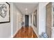 Well-lit hallway with hardwood floors, neutral paint, and elegant decor at 2575 Peachtree Ne Rd # 11D, Atlanta, GA 30305