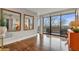 Hallway with hardwood flooring leading to an outdoor balcony at 2575 Peachtree Ne Rd # 11D, Atlanta, GA 30305