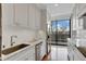 Bright kitchen features stainless steel appliances, granite countertops, and hardwood floors at 2575 Peachtree Ne Rd # 11D, Atlanta, GA 30305