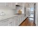 Bright kitchen featuring white cabinets and granite countertops at 2575 Peachtree Ne Rd # 11D, Atlanta, GA 30305
