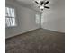 Bright bedroom with carpet, ceiling fan and large window at 420 Florence Rd, Douglasville, GA 30134