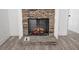 Stunning stone fireplace with electric firebox and wood mantel at 420 Florence Rd, Douglasville, GA 30134