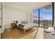 Bright bedroom with city views and hardwood floors at 788 W Marietta Nw St # 1513, Atlanta, GA 30318