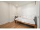 Small bedroom with a daybed and wood floors at 788 W Marietta Nw St # 1513, Atlanta, GA 30318