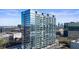 Modern highrise building with glass facade and balconies, showcasing city views at 788 W Marietta Nw St # 1513, Atlanta, GA 30318