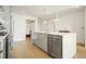 Modern kitchen with gray cabinets and large island at 788 W Marietta Nw St # 1513, Atlanta, GA 30318