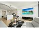 Living room features an open floor plan, hardwood floors, and a large TV at 788 W Marietta Nw St # 1513, Atlanta, GA 30318