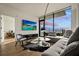 Modern living room with city view, large sectional sofa, and hardwood floors at 788 W Marietta Nw St # 1513, Atlanta, GA 30318