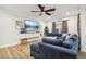 Finished basement with sectional sofa and a built-in entertainment center at 3051 Oglethorpe Ne Way, Brookhaven, GA 30319