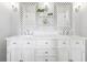 Elegant bathroom with double vanity, marble countertop, and decorative mirrors at 3051 Oglethorpe Ne Way, Brookhaven, GA 30319