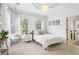 Bright bedroom with a comfy bed, hanging chair, and ample natural light at 3051 Oglethorpe Ne Way, Brookhaven, GA 30319