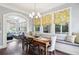 Charming breakfast nook with built-in bench seating and a window overlooking the backyard at 3051 Oglethorpe Ne Way, Brookhaven, GA 30319