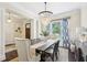 Bright dining room features a rustic wood table, chandelier, and stylish decor at 3051 Oglethorpe Ne Way, Brookhaven, GA 30319