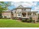 Two-story home with brick and siding exterior, front porch, and landscaping at 3051 Oglethorpe Ne Way, Brookhaven, GA 30319