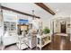 Living room with exposed beams, built-in shelving, and a fireplace at 3051 Oglethorpe Ne Way, Brookhaven, GA 30319