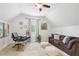 Versatile office/guest room with a desk, sofa, and ample natural light at 3051 Oglethorpe Ne Way, Brookhaven, GA 30319