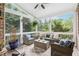 Relaxing screened porch with wicker furniture and ceiling fan at 3051 Oglethorpe Ne Way, Brookhaven, GA 30319