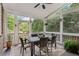 Screened porch dining area with table and chairs at 3051 Oglethorpe Ne Way, Brookhaven, GA 30319