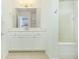 Clean bathroom with white vanity and bathtub at 3040 Peachtree Rd # 802, Atlanta, GA 30305