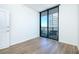 Bedroom with hardwood floors and balcony access at 3040 Peachtree Rd # 802, Atlanta, GA 30305