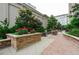 Community grilling area and sitting in a landscaped courtyard at 3040 Peachtree Rd # 802, Atlanta, GA 30305