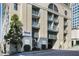 Building entrance with signage and landscaping at 3040 Peachtree Rd # 802, Atlanta, GA 30305