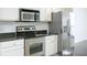 Modern kitchen with stainless steel appliances and granite countertops at 3040 Peachtree Rd # 802, Atlanta, GA 30305