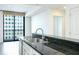 Modern kitchen with stainless steel appliances and granite countertops at 3040 Peachtree Rd # 802, Atlanta, GA 30305