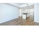 Open concept living space with hardwood floors and kitchen access at 3040 Peachtree Rd # 802, Atlanta, GA 30305