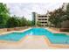 Inviting pool with plenty of lounge chairs and a spacious patio at 3040 Peachtree Rd # 802, Atlanta, GA 30305