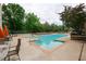 Refreshing pool area with lounge chairs and a surrounding patio at 3040 Peachtree Road # 802, Atlanta, GA 30305