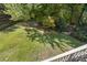 Large backyard with lush green grass and mature trees at 1736 Ridge Valley Ct, Atlanta, GA 30327