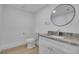 Simple bathroom with granite countertop and white vanity at 1770 Austin Dr, Decatur, GA 30032