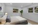 Bright bedroom with light wood floors, large windows, and a comfortable bed at 1770 Austin Dr, Decatur, GA 30032
