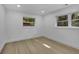 Spacious bedroom with light wood floors and large windows, offering ample natural light at 1770 Austin Dr, Decatur, GA 30032