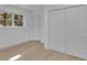 Well-lit bedroom with wood flooring and built-in closet at 1770 Austin Dr, Decatur, GA 30032